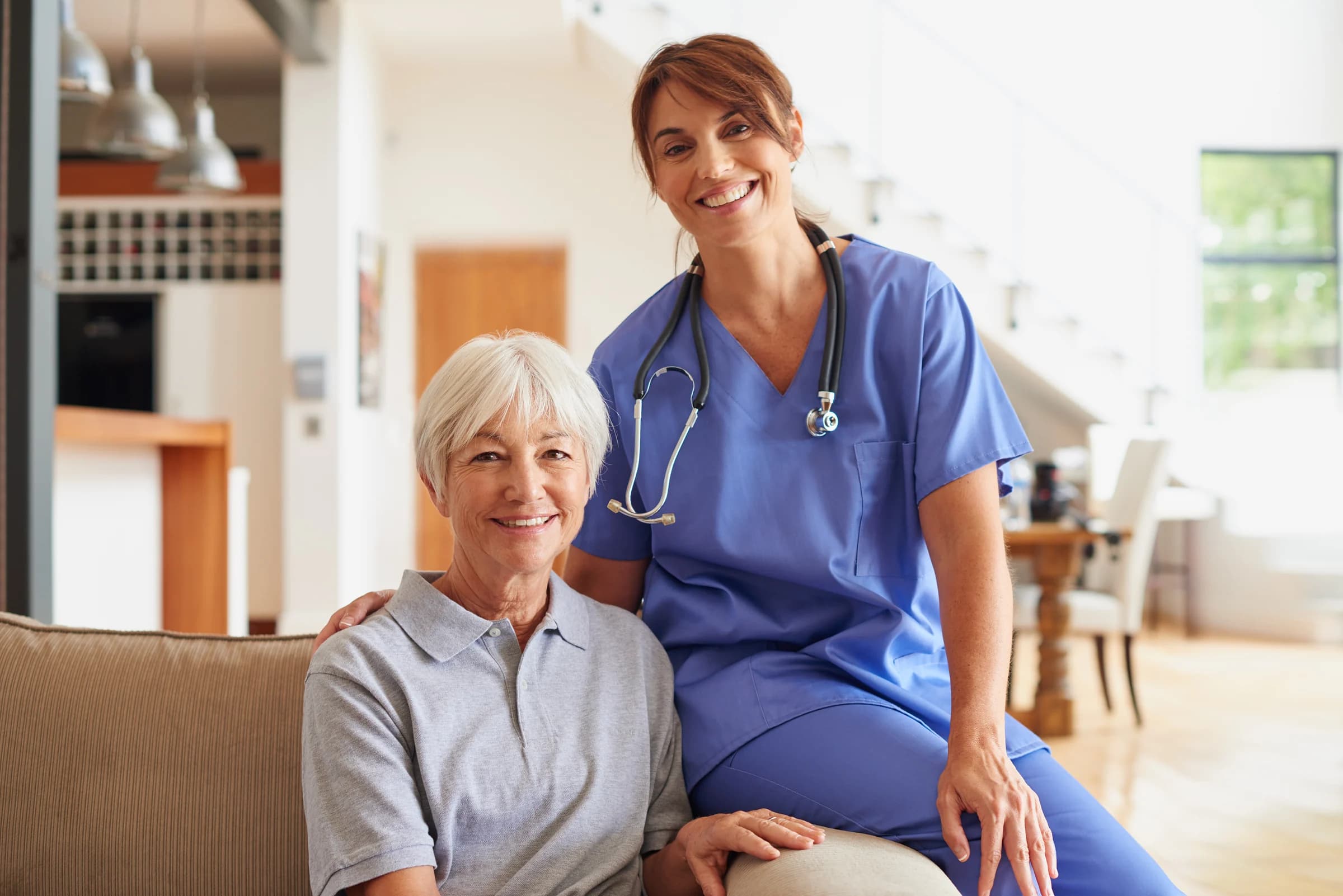 A caring nurse supporting an elderly resident with warmth and compassion